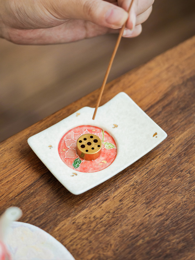 Lotus-inspired porcelain incense holder blending art and function