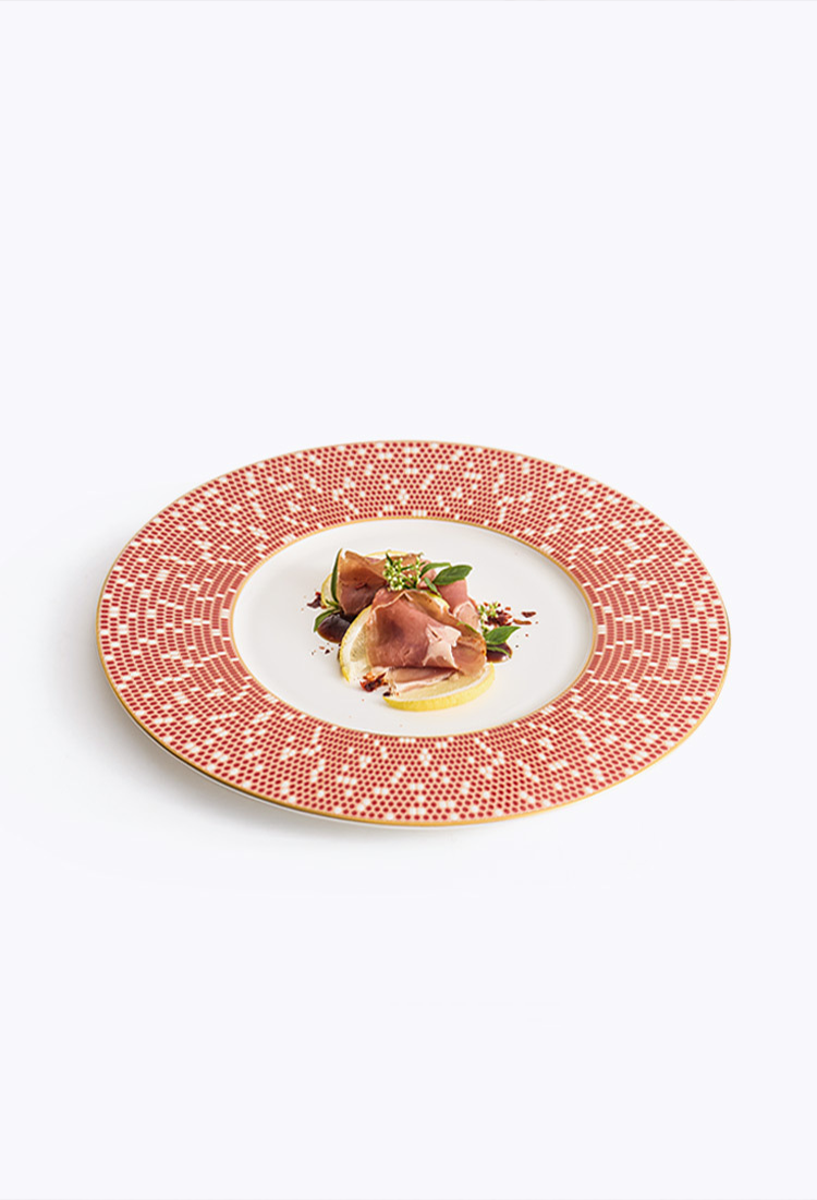 Luxury home hosting dinnerware with a vibrant "Golden Red" celestial aesthetic.
