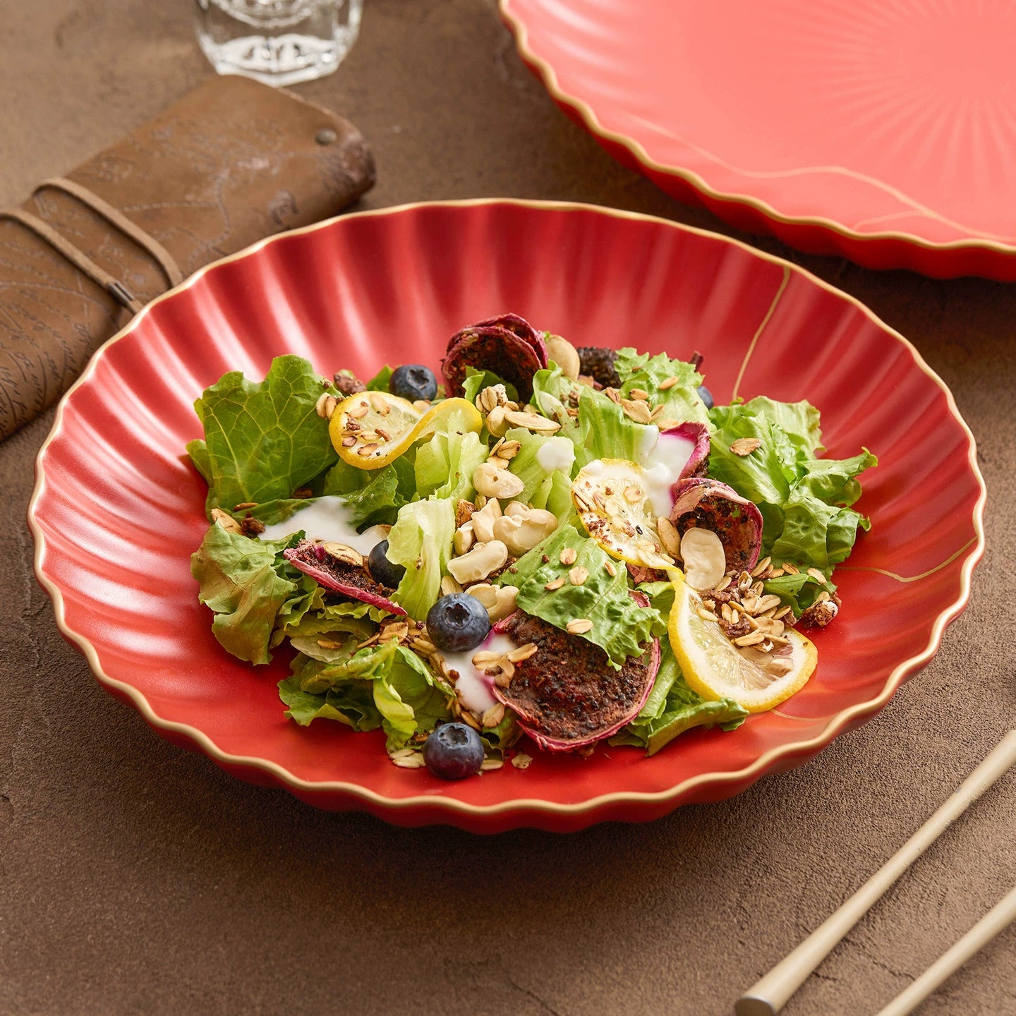 Luxury red ceramic salad bowl with golden wave edge