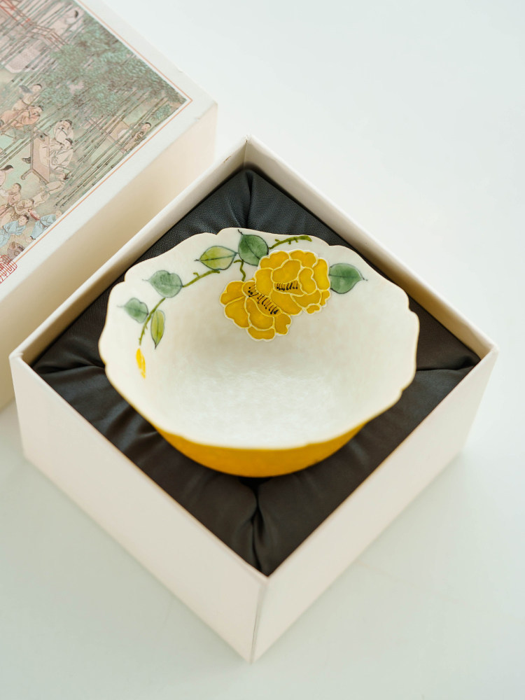 Luxury tea gift packaging including a square heritage-themed box and a 70ml porcelain cup.