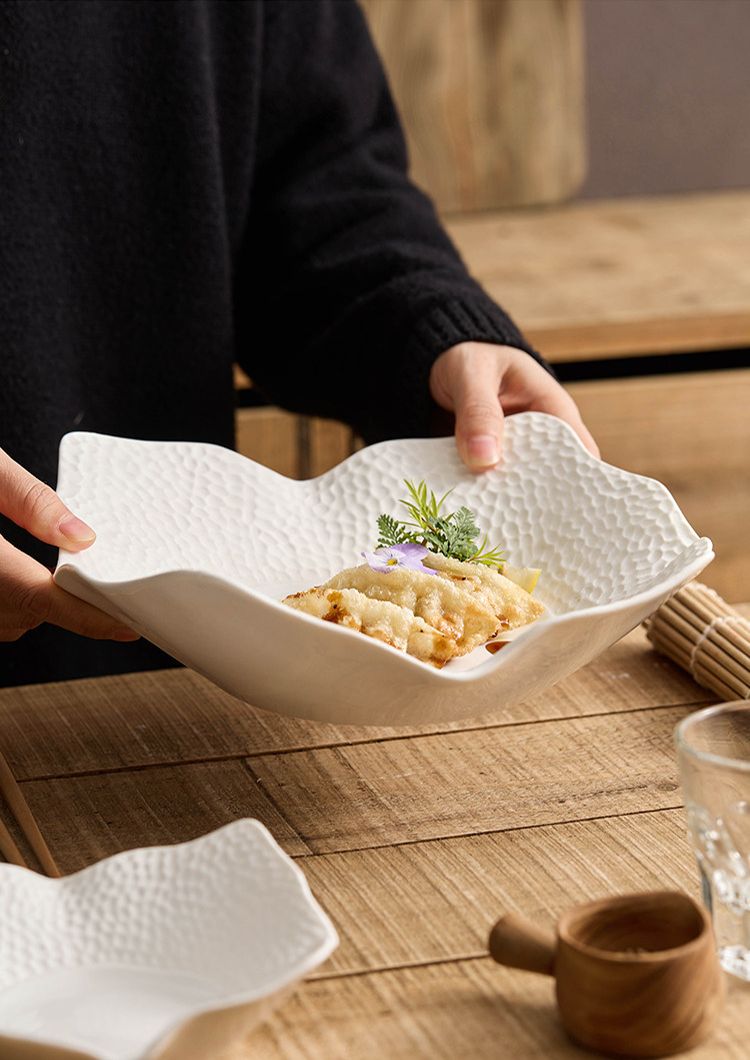 Matte white ceramic square plate safe for oven and air fryer use.