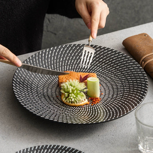 Meteor shower ceramic dinner plate on wooden table

