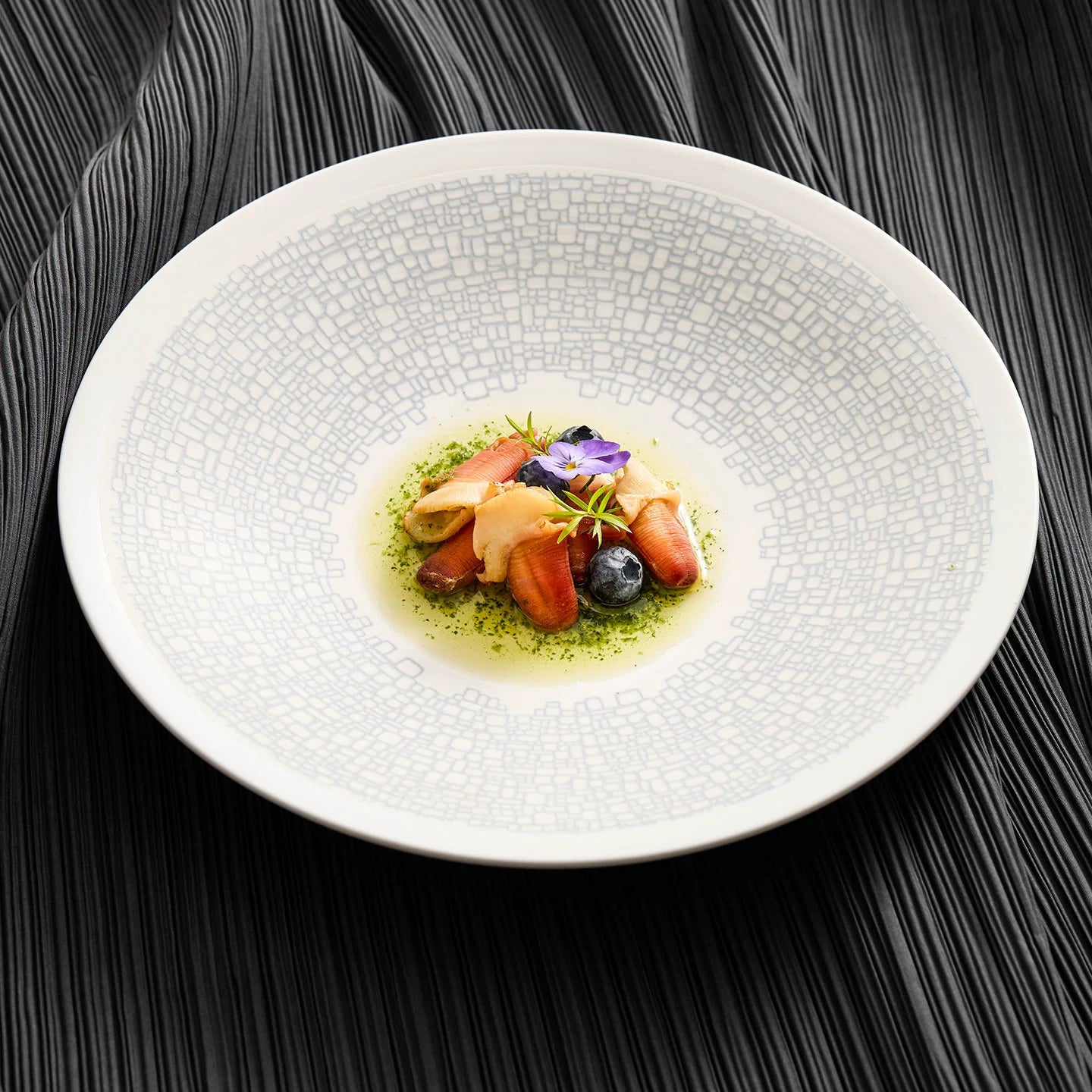 Minimalist 11-inch ceramic pasta plate with a light-blue mosaic pattern.