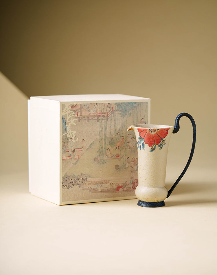 Minimalist ceramic tea vessel with dark curved handle