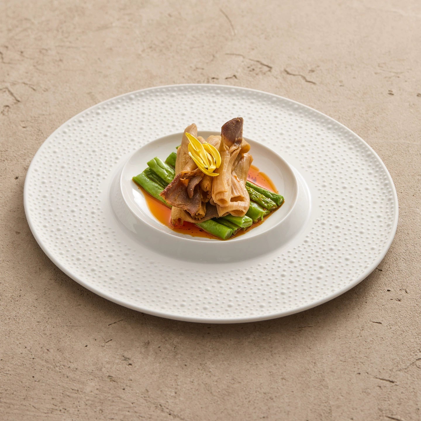 Minimalist inner coupe plate designed for chef-style plating and sauce-forward dishes