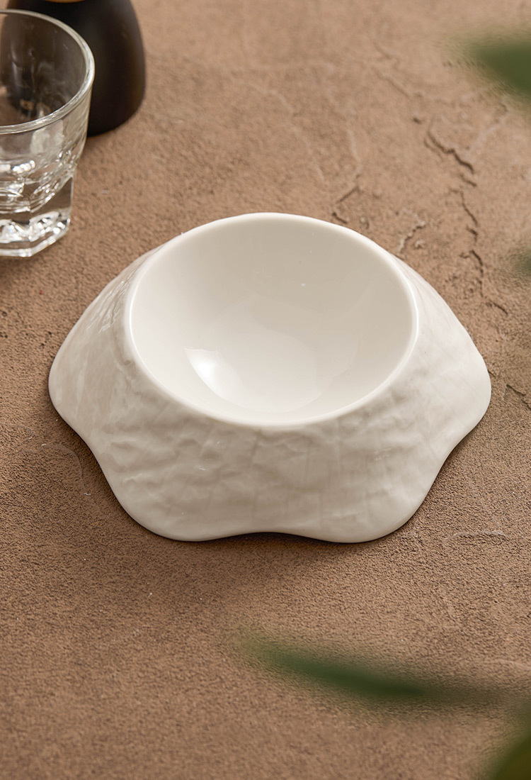 Minimalist moon-white bowl with soft petal-like ridges by GOSEUNG