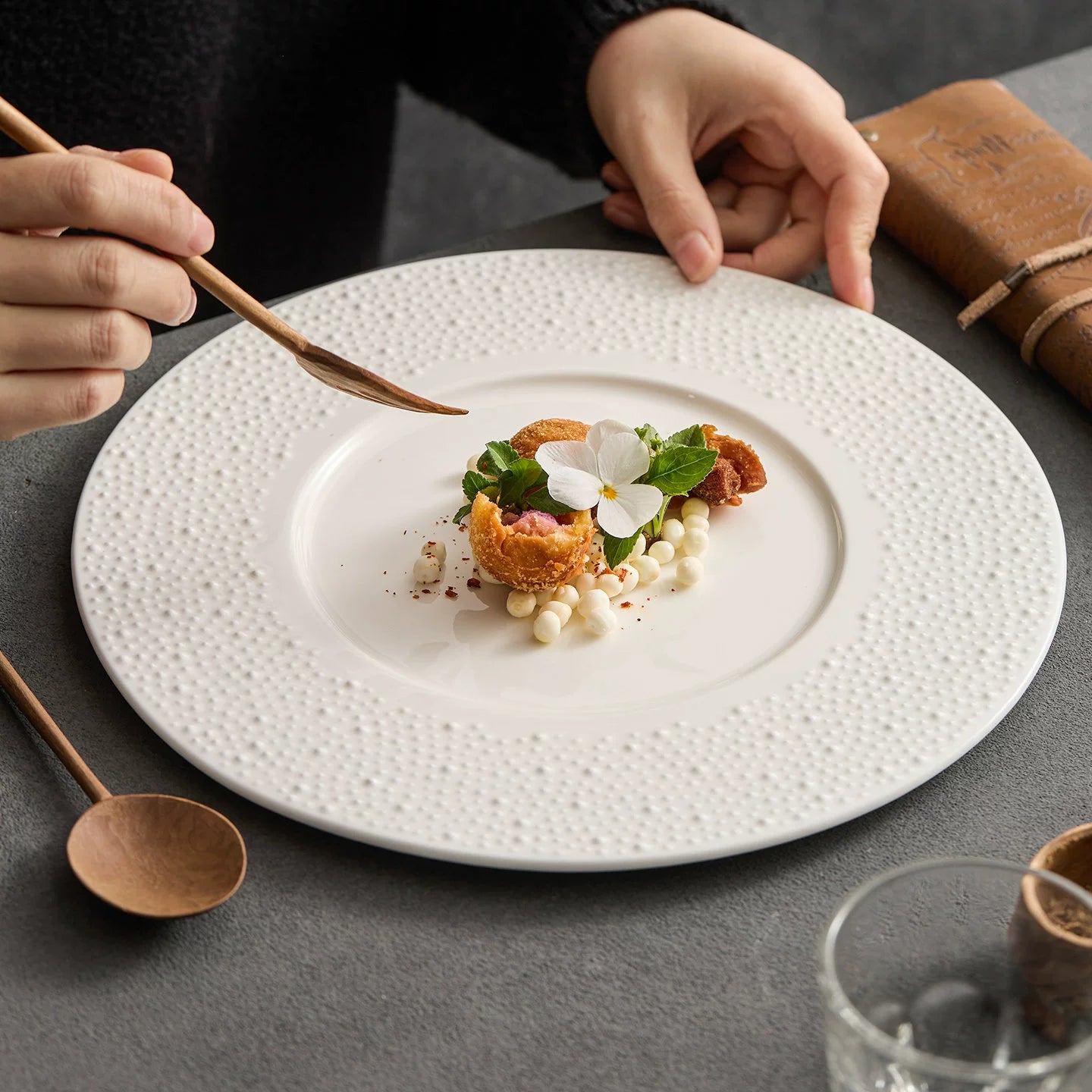 Minimalist off-white sesame point textured flat plate for professional food plating.