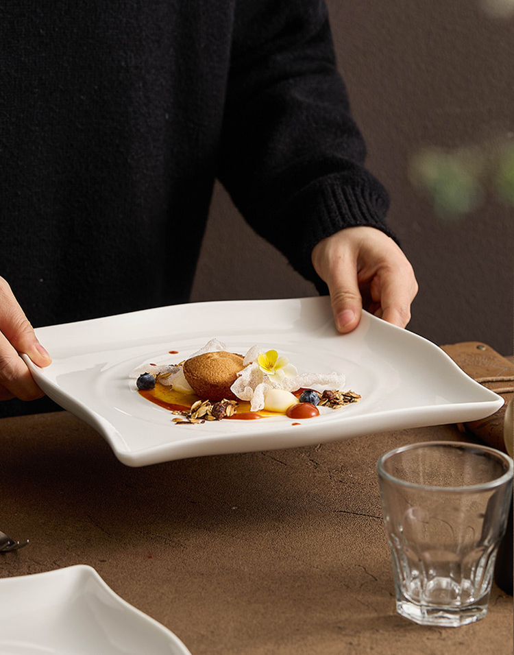 Minimalist white plate styled with elegant dish plating