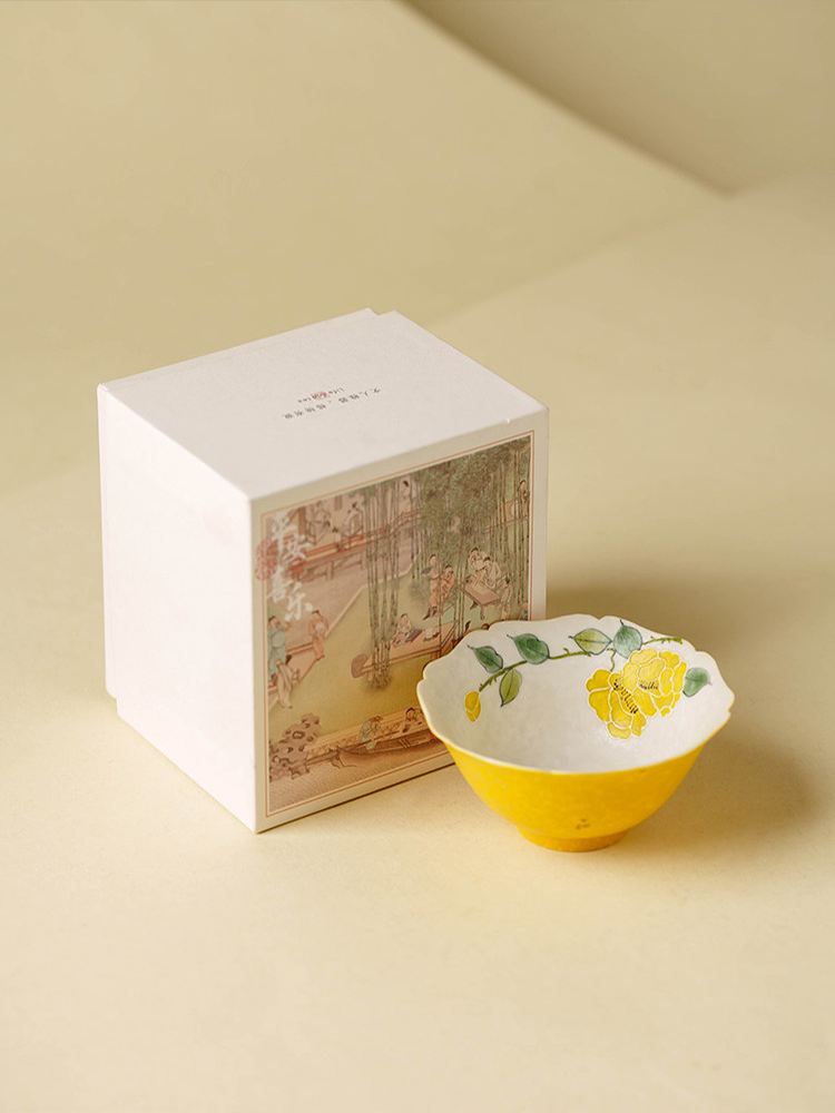 Minimalist yellow and white porcelain tea cup for artisanal tea drinking and collectors.