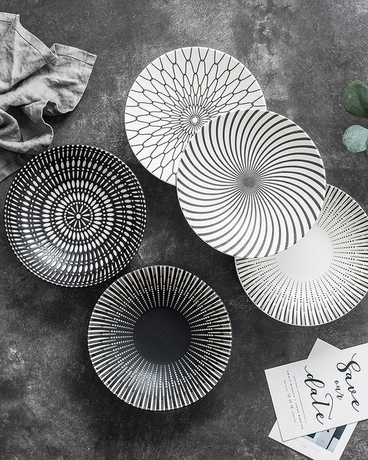Modern ceramic bowl with minimalist radial stripe design

