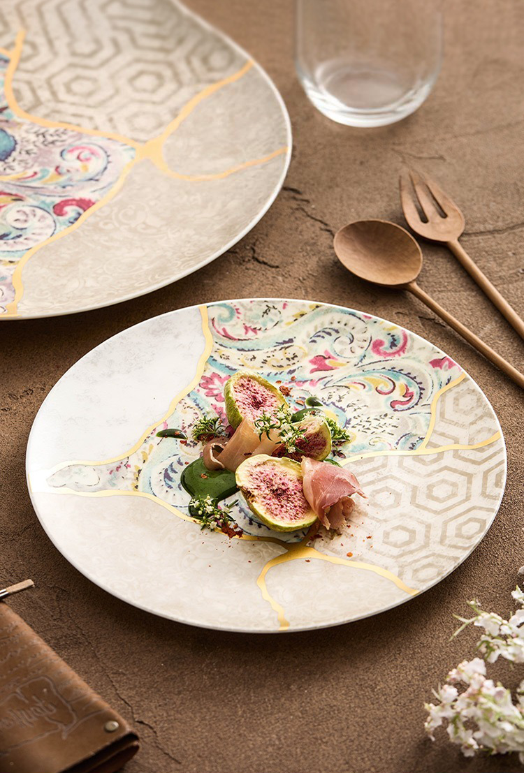 Modern kintsugi-style porcelain plate with brocade motifs
