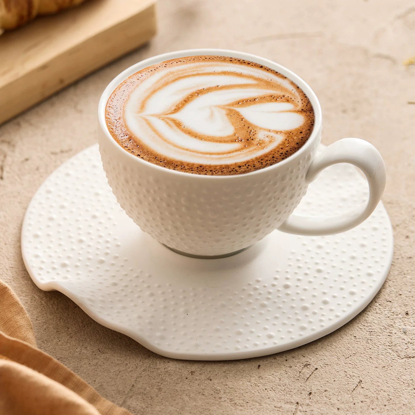 Modern minimalist 164ml ceramic coffee cup with irregular rim saucer.