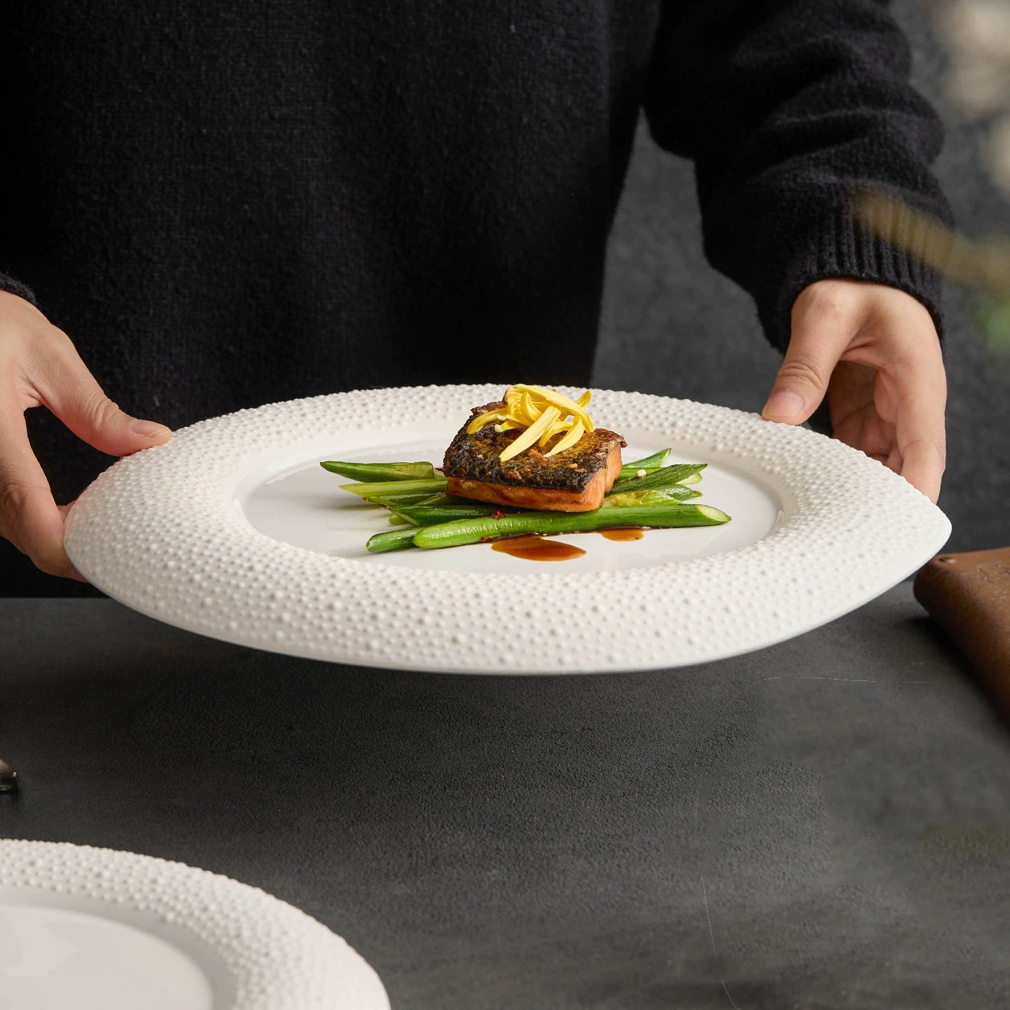 Modern minimalist dinner plate with pebble texture and soft matte glaze.