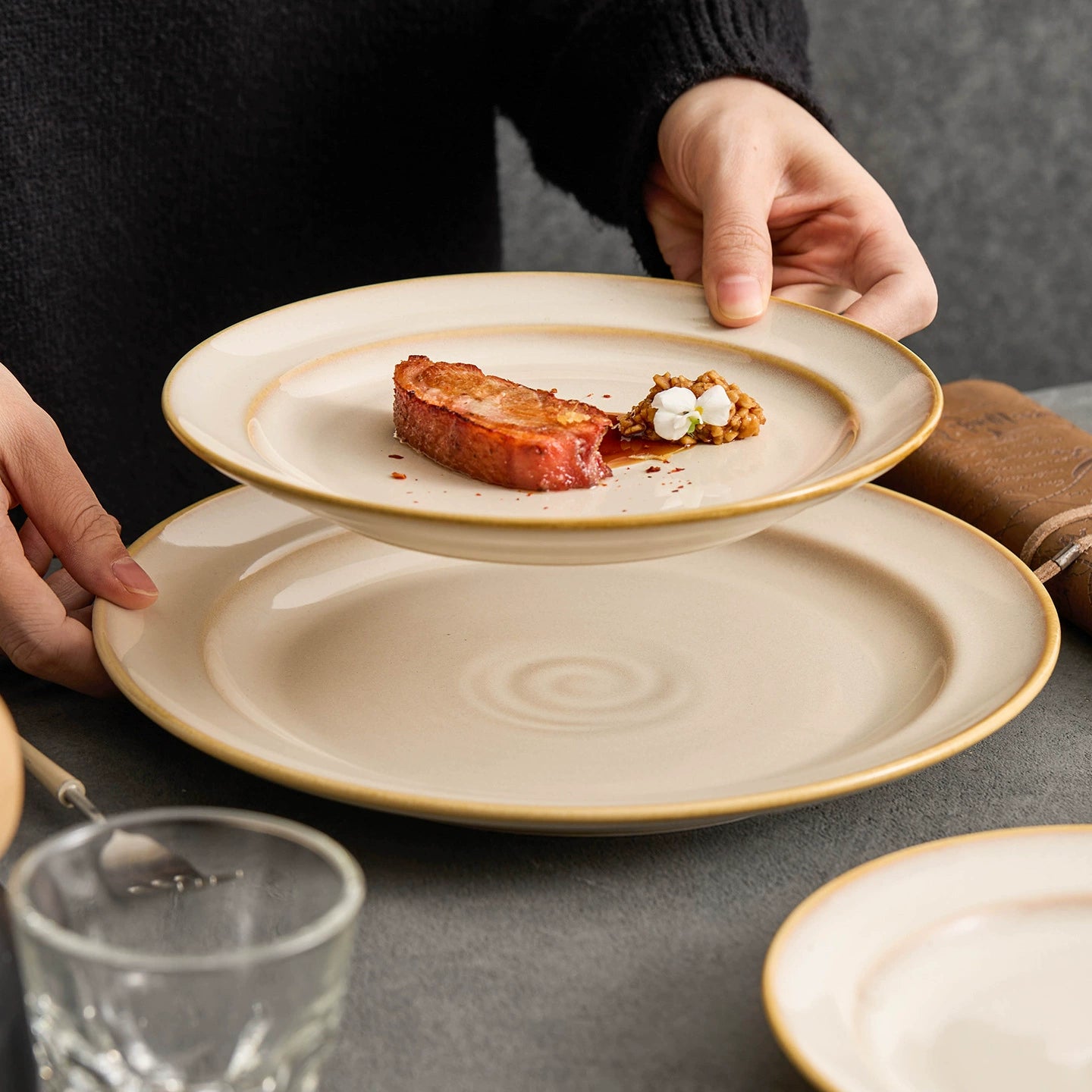 Modern round ceramic plate with a meditative spiral design at the center.