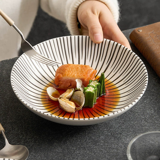 Modern round dish with radial stripe design

