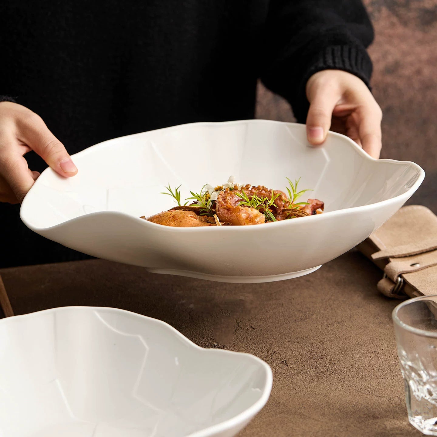 Modern white irregular serving bowl for fine dining and artistic food styling.