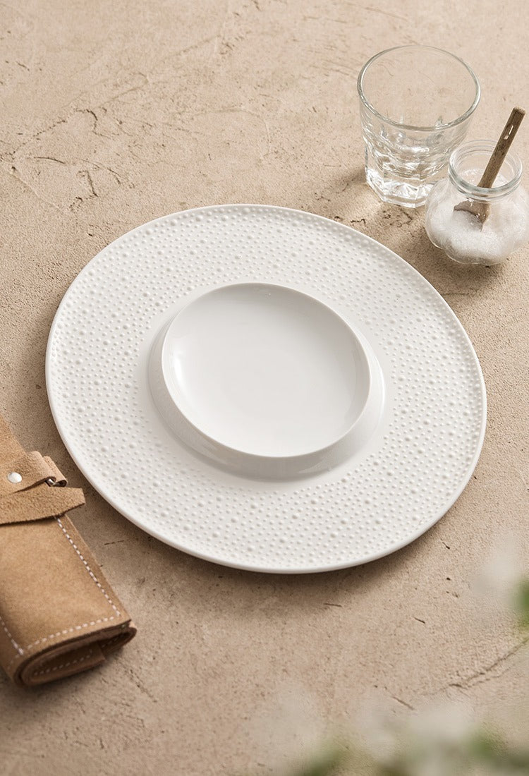 Modern white porcelain plate ideal for tasting menus and chef-driven main courses