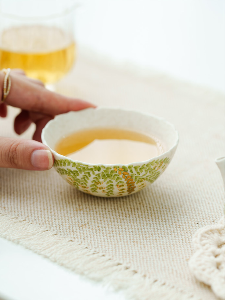 Nature inspired ceramic teacup with leaf painting