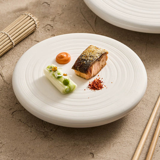 Off-white sesame point textured 6-inch ceramic bread and butter plate.