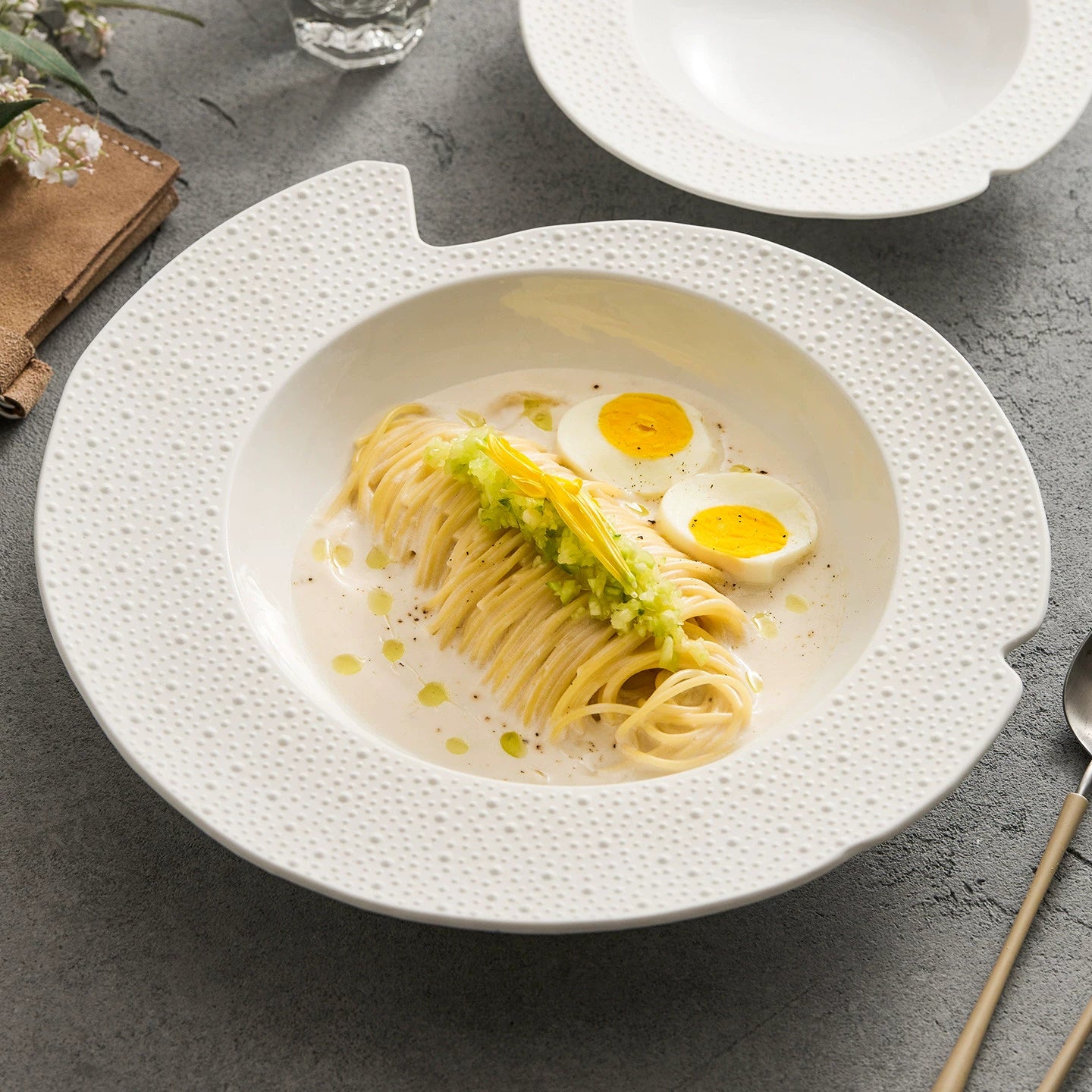 Off-white sesame point textured irregular rim bowl for professional plating.