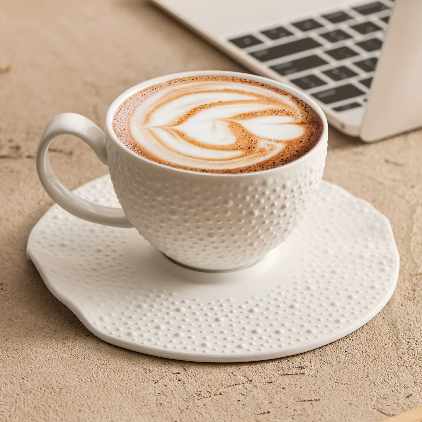 Off-white sesame point textured matte coffee cup and saucer set.