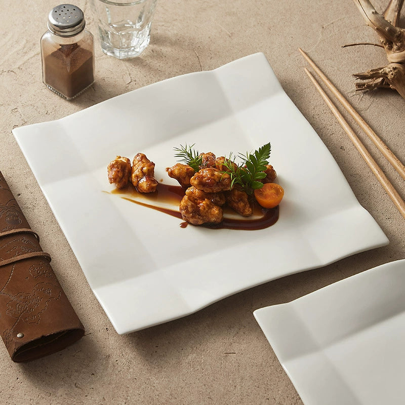 Origami-inspired square ceramic plate for fine dining presentation