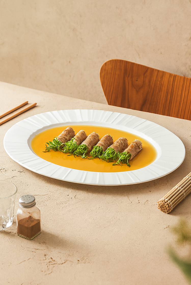 Oval ceramic platter with embossed rim design