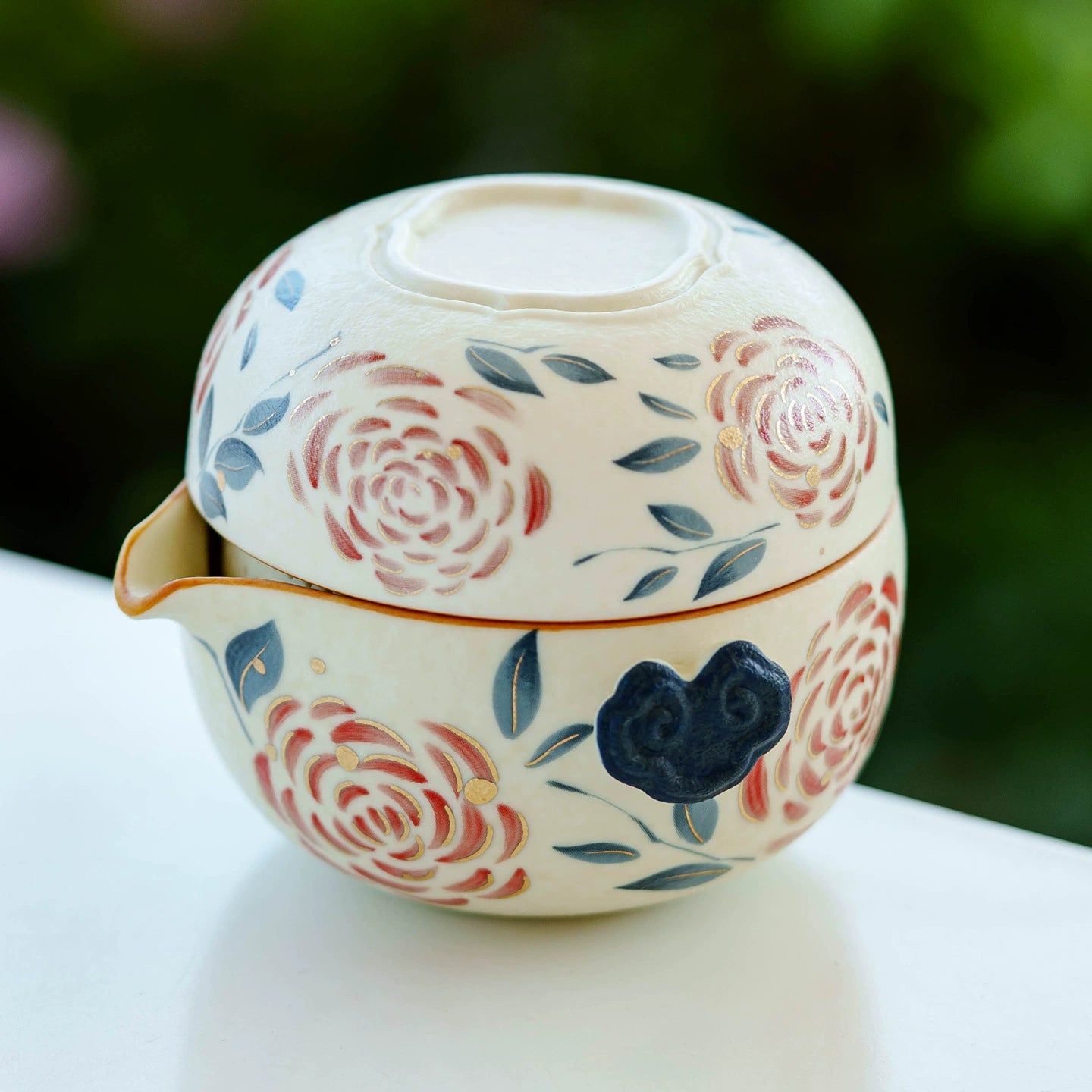 Portable ceramic tea set with hand-painted roses