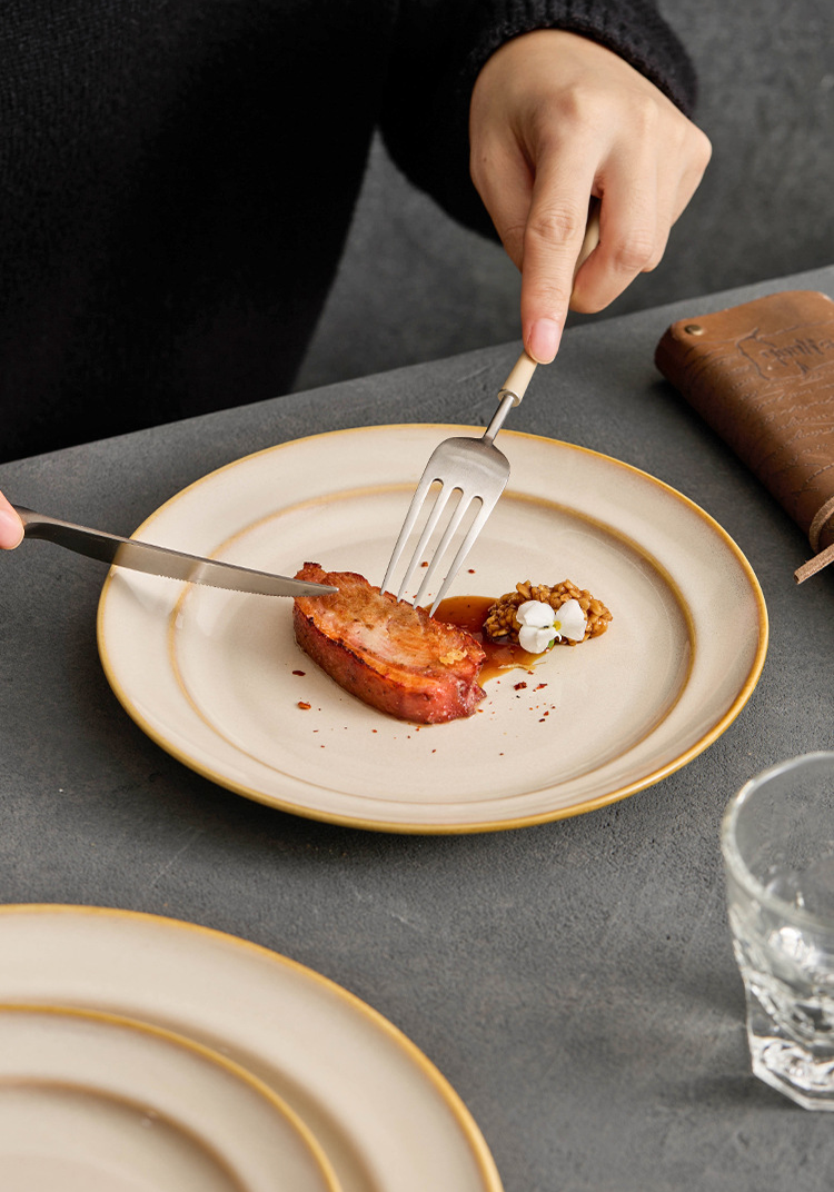 Professional culinary presentation using a spiral-patterned plate as a focused canvas.