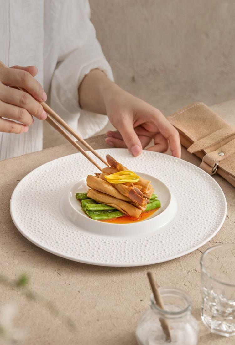 Professional restaurant-grade porcelain dinner plate with minimalist texture