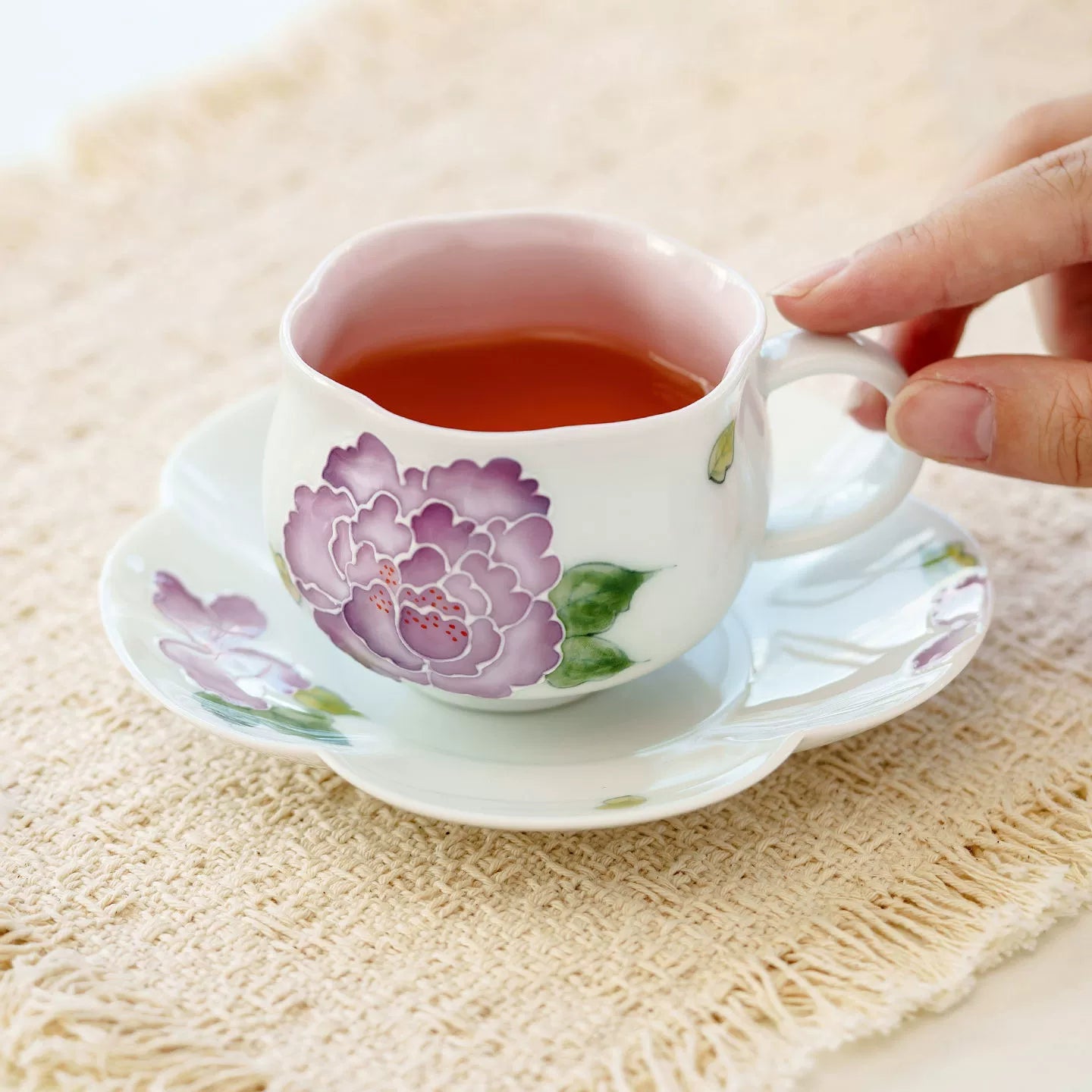 Purple flower porcelain cup with matching saucer