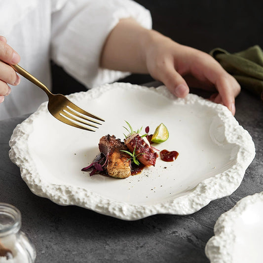 Rock pattern ceramic skirt plate with textured edge design

