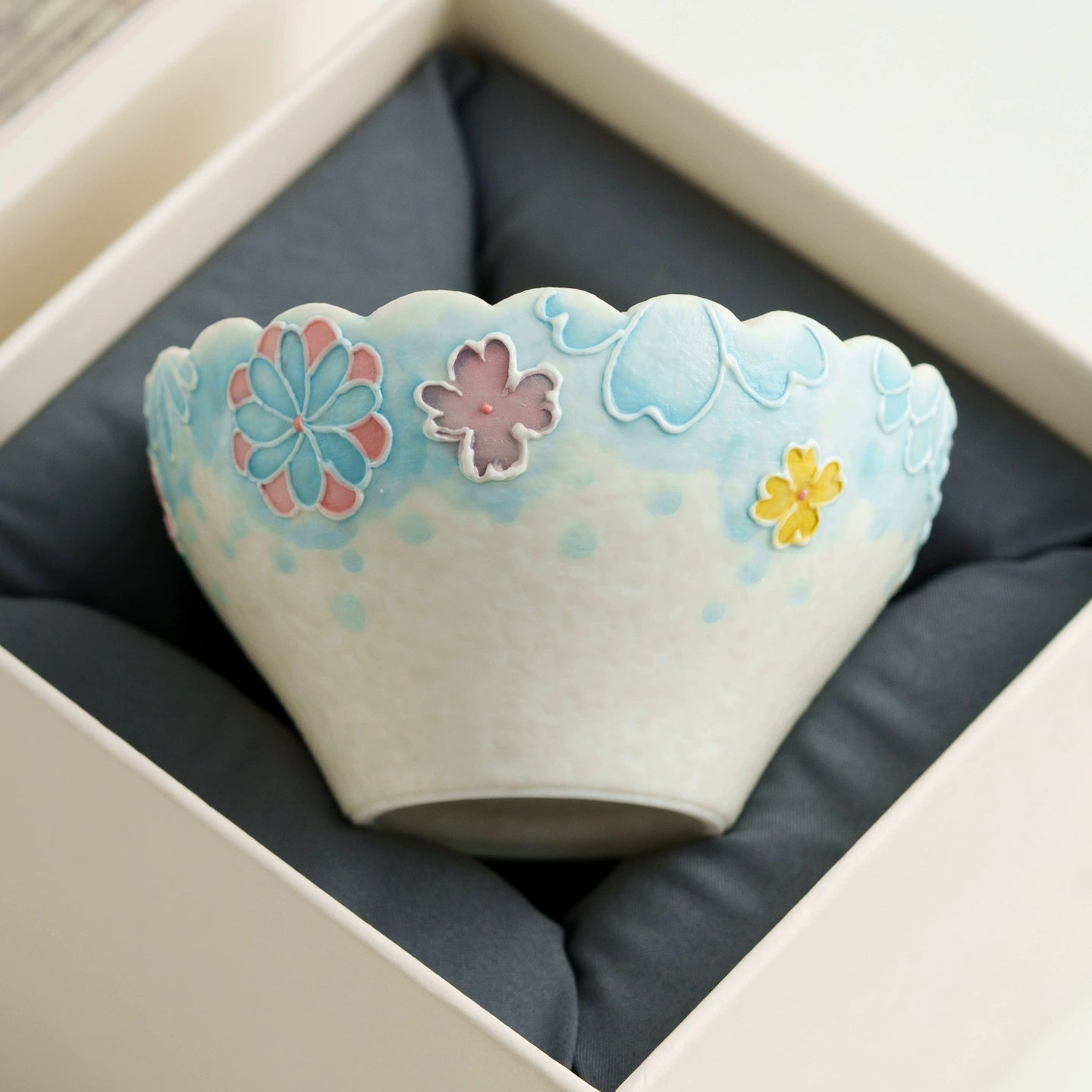 Scalloped rim ceramic floral teacup