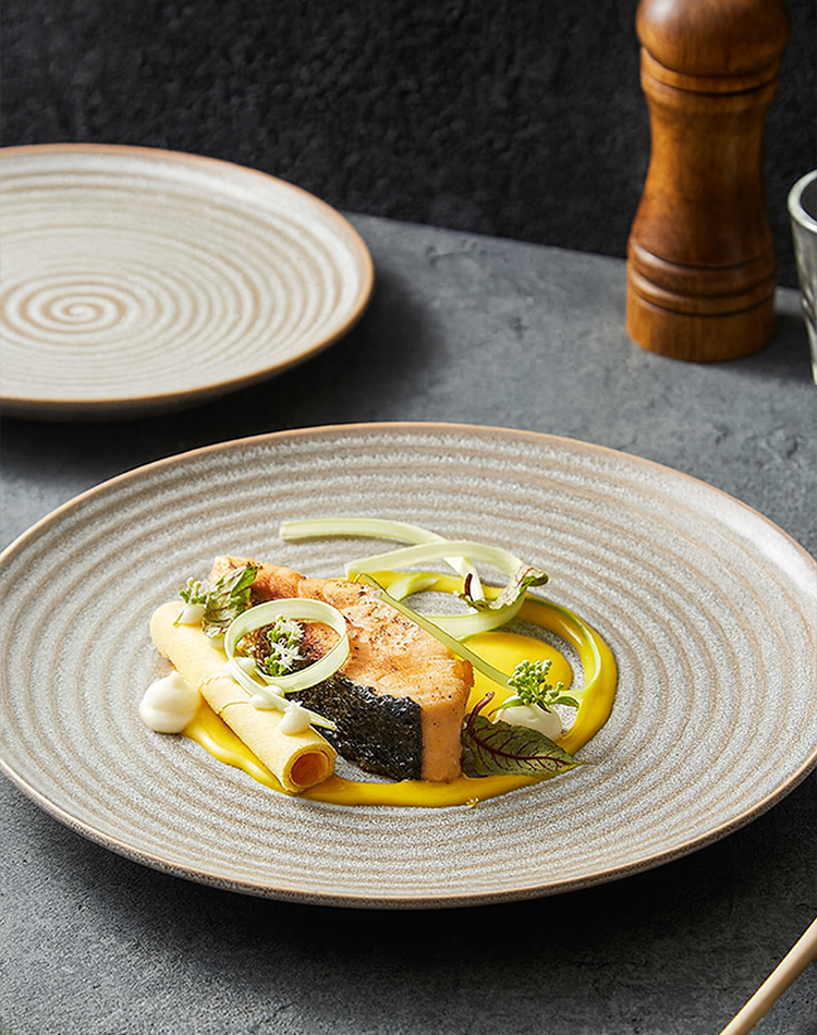 Scandinavian-style handmade stoneware plate on neutral tabletop