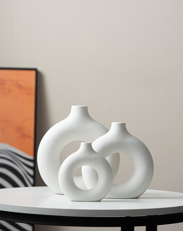 Modern tabletop decor with Nordic white ceramic vases

