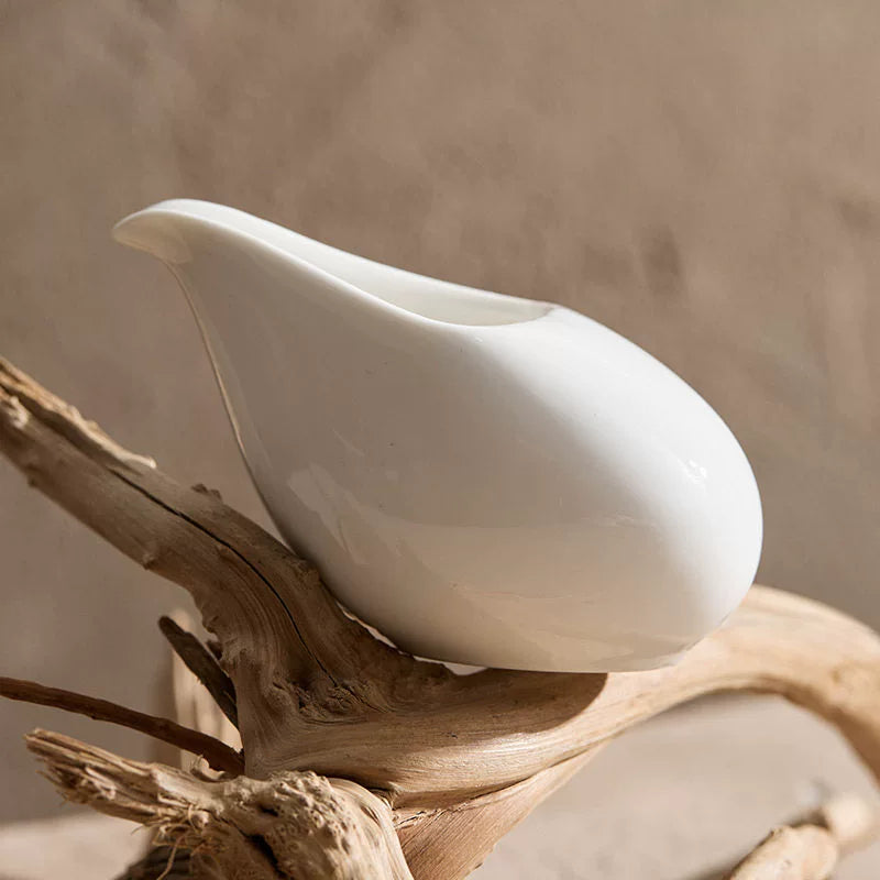 Side view of 4-inch and 5-inch ceramic pebble sauce boats showing size comparison.