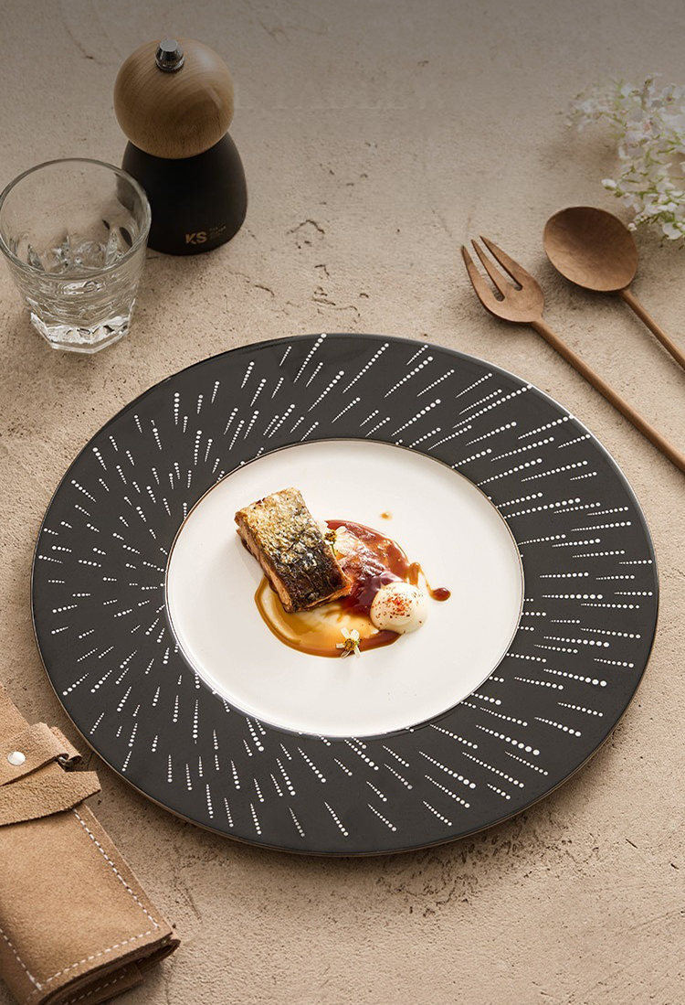 Side view of a slim-profile celestial plate with a golden-hued base rim.