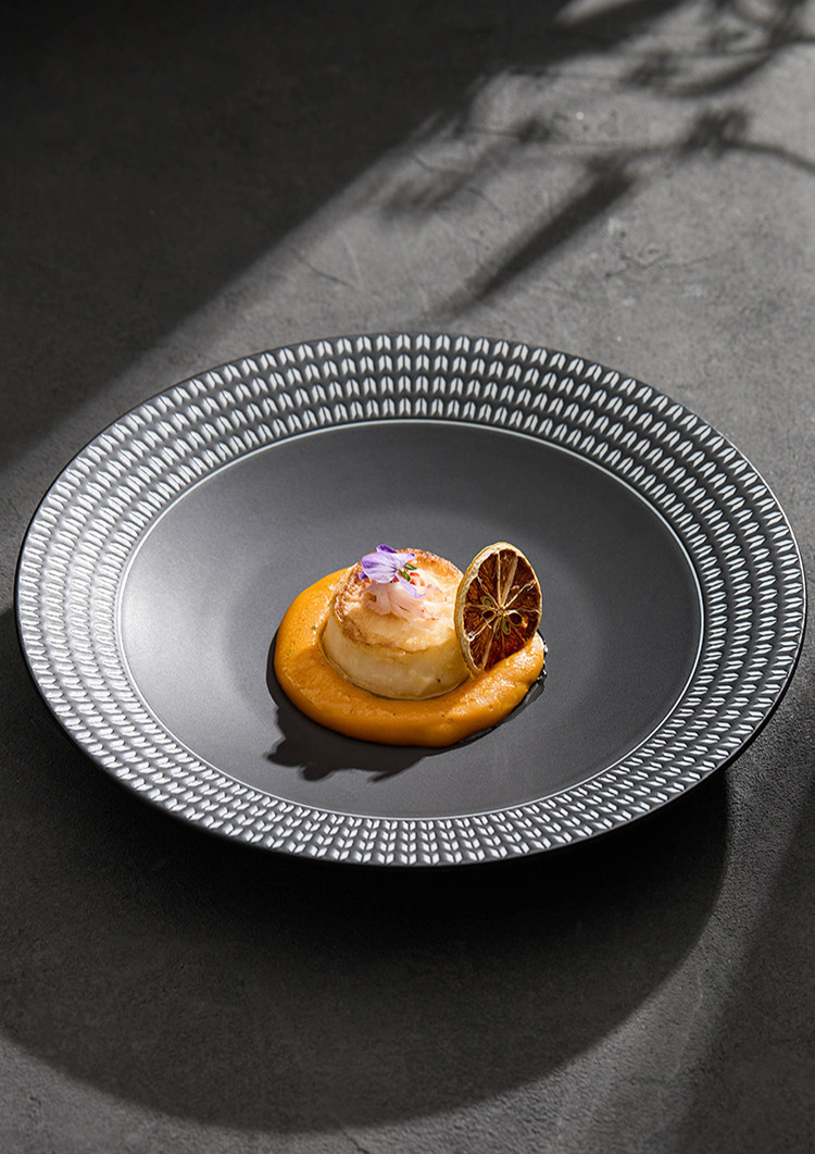 Silky matte finish of a heavyweight ceramic soup plate, highlighting the premium craftsmanship.