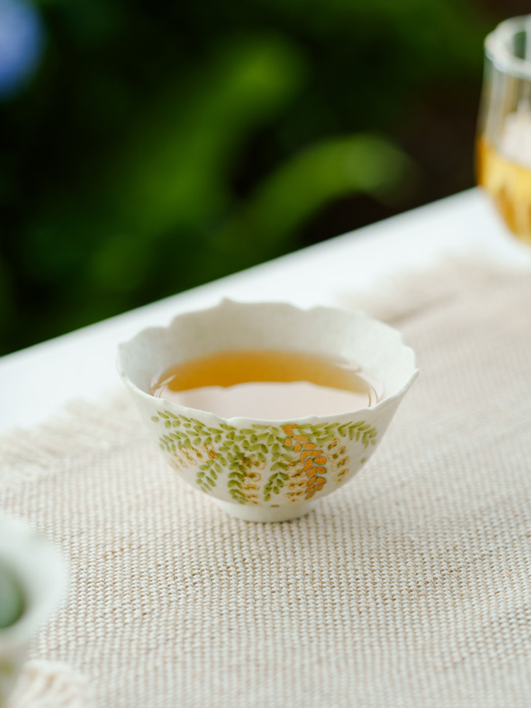 Small Chinese ceramic tea cup with nature motif
