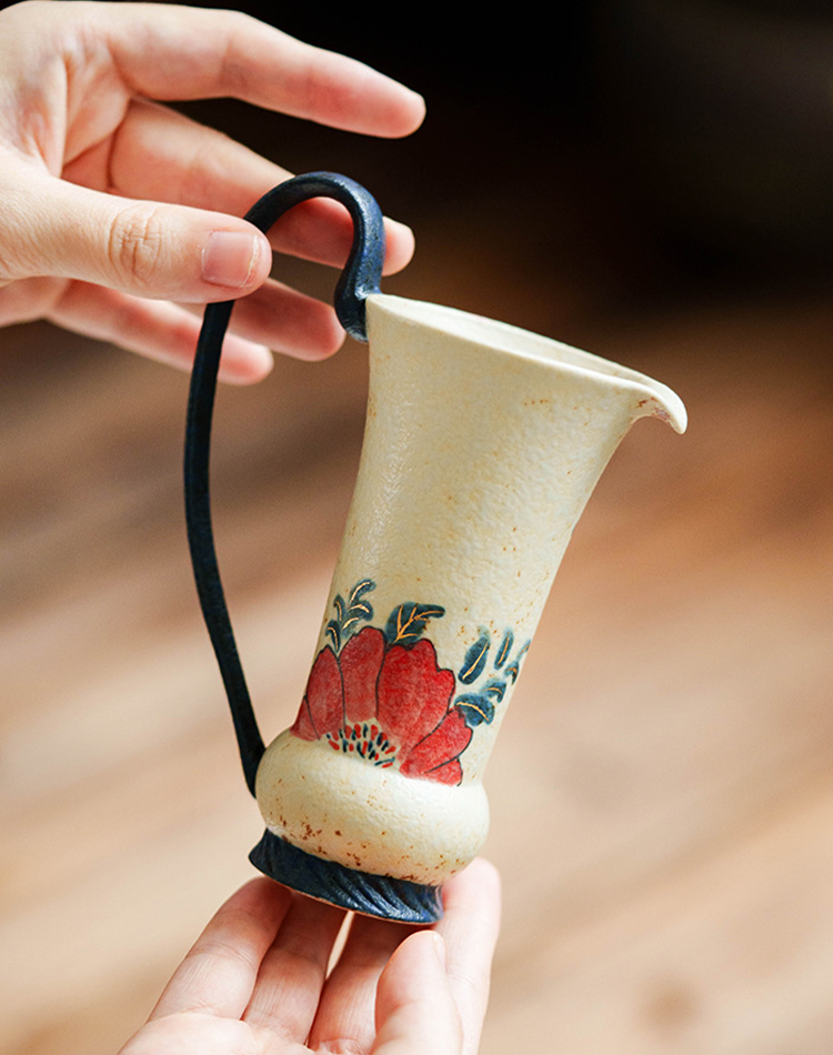 Small ceramic milk or tea pitcher with red petals