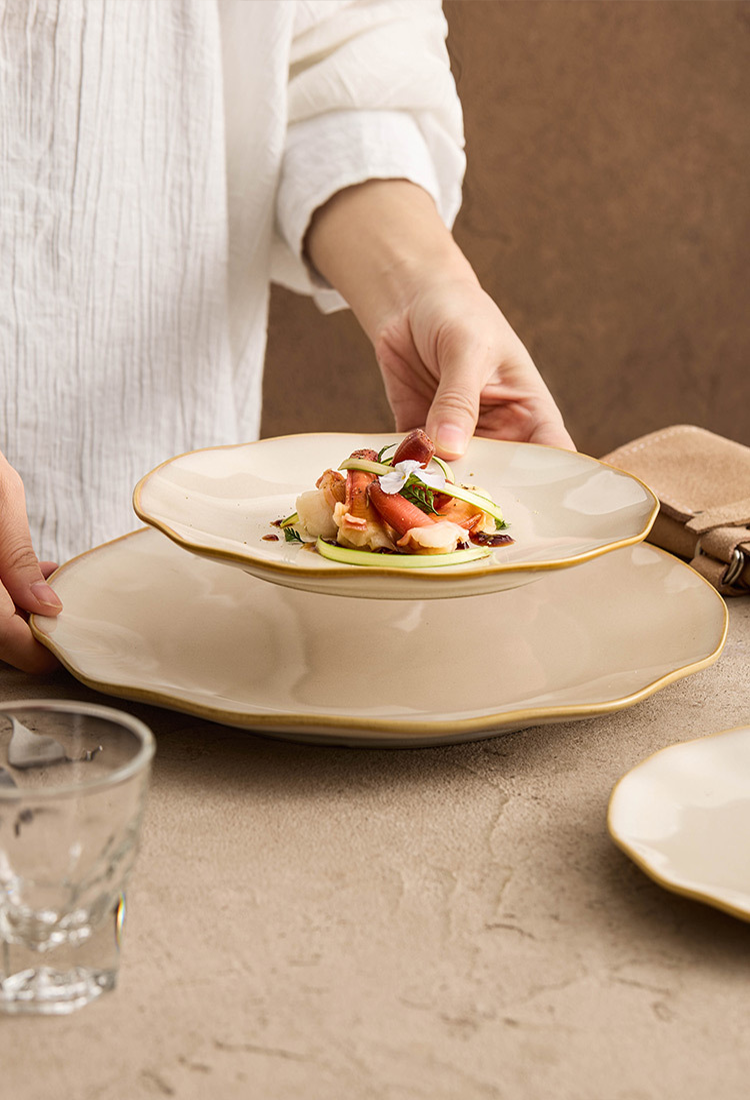 Sophisticated culinary presentation using the wavy rim as a sculptural frame for high-end gastronomy.