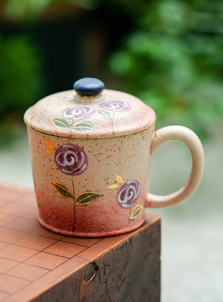 Speckled beige ceramic mug with hand-painted blossoms