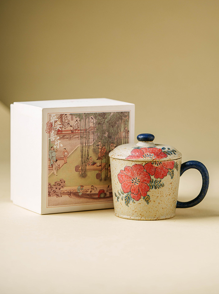 Speckled beige ceramic mug with red flower motif