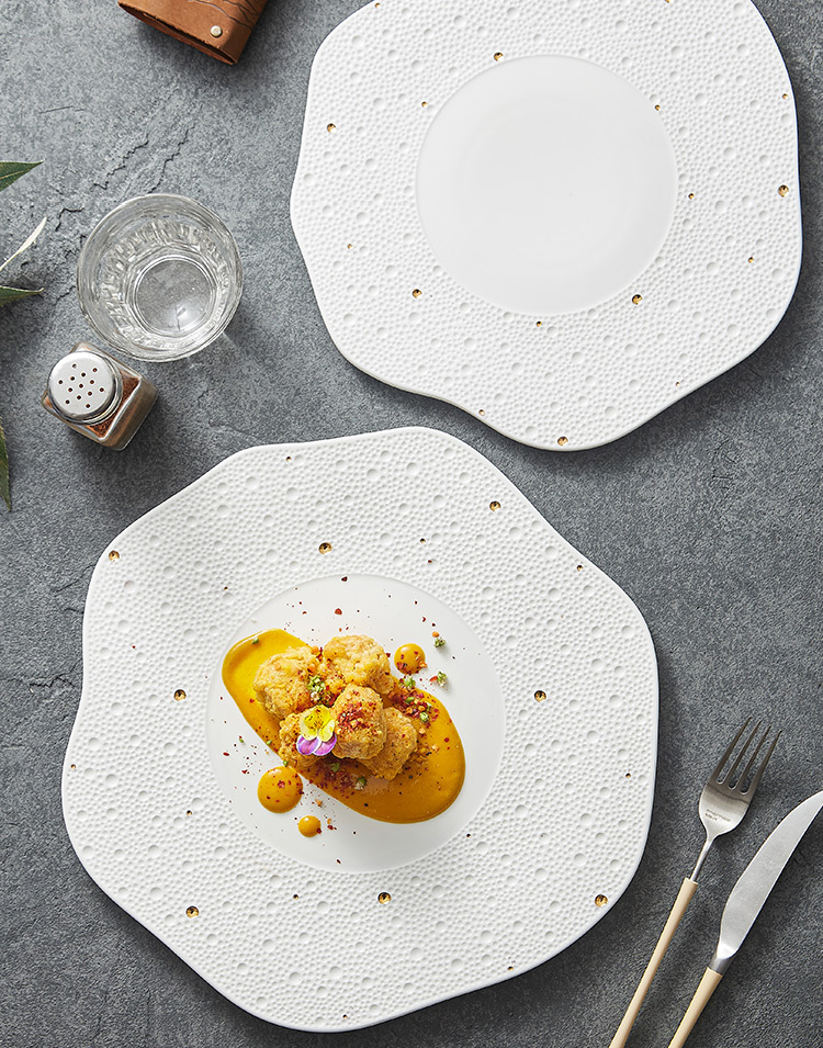 Table setting with gold-dotted textured porcelain plate