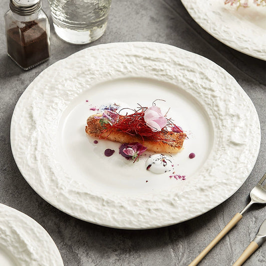 Textured ceramic plate with irregular stone-like rim

