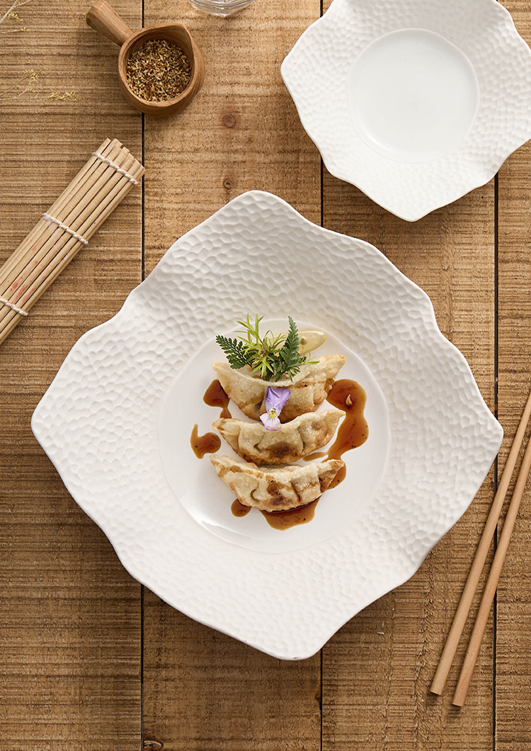 Textured minimalist square dish compatible with disinfection cabinets and steamers.