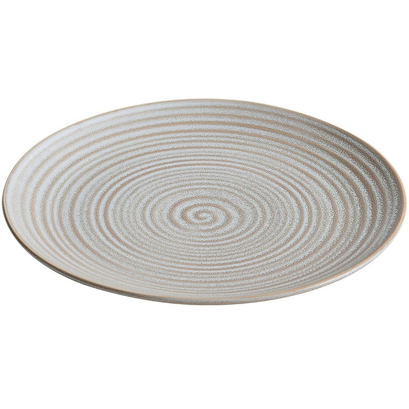 Textured porcelain plate showcasing minimalist Scandinavian elegance