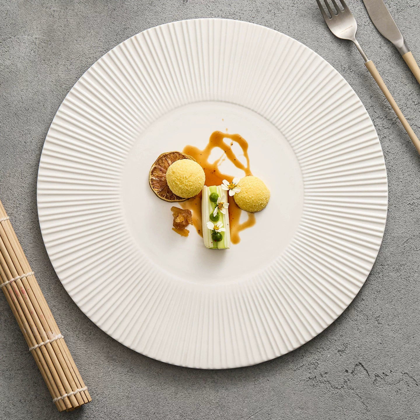Textured white ceramic service plate for modern fine dining.