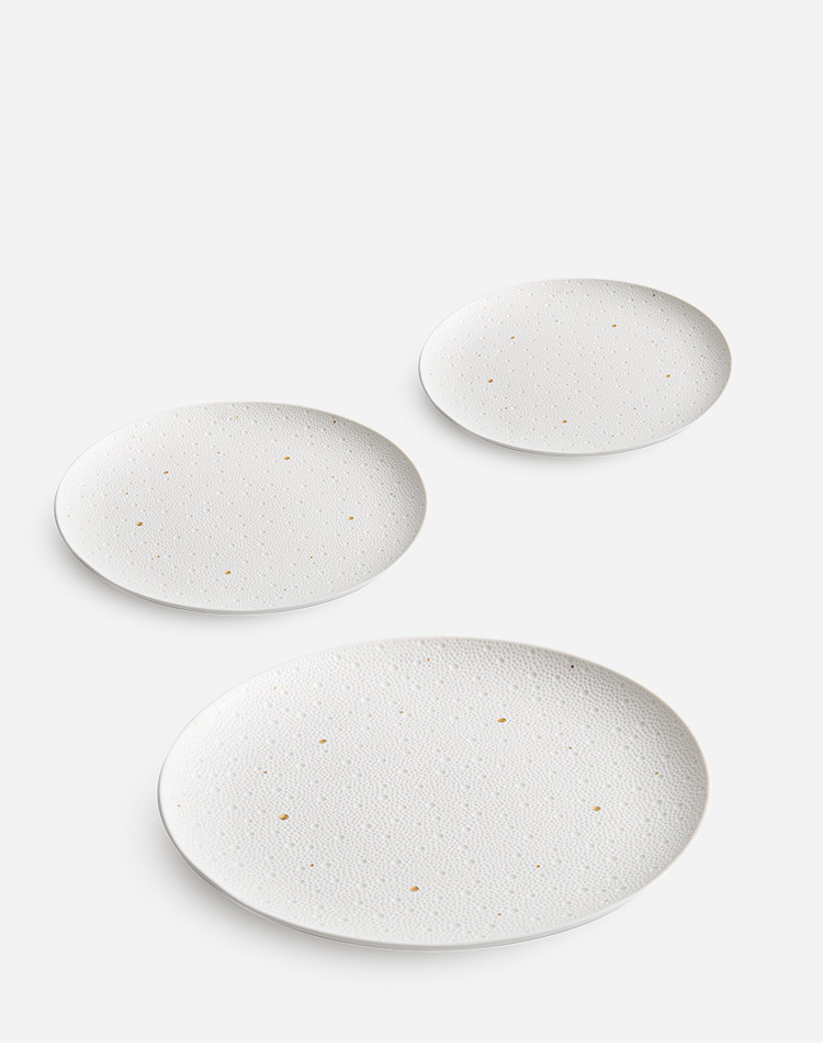 Textured white dining plate with artistic surface