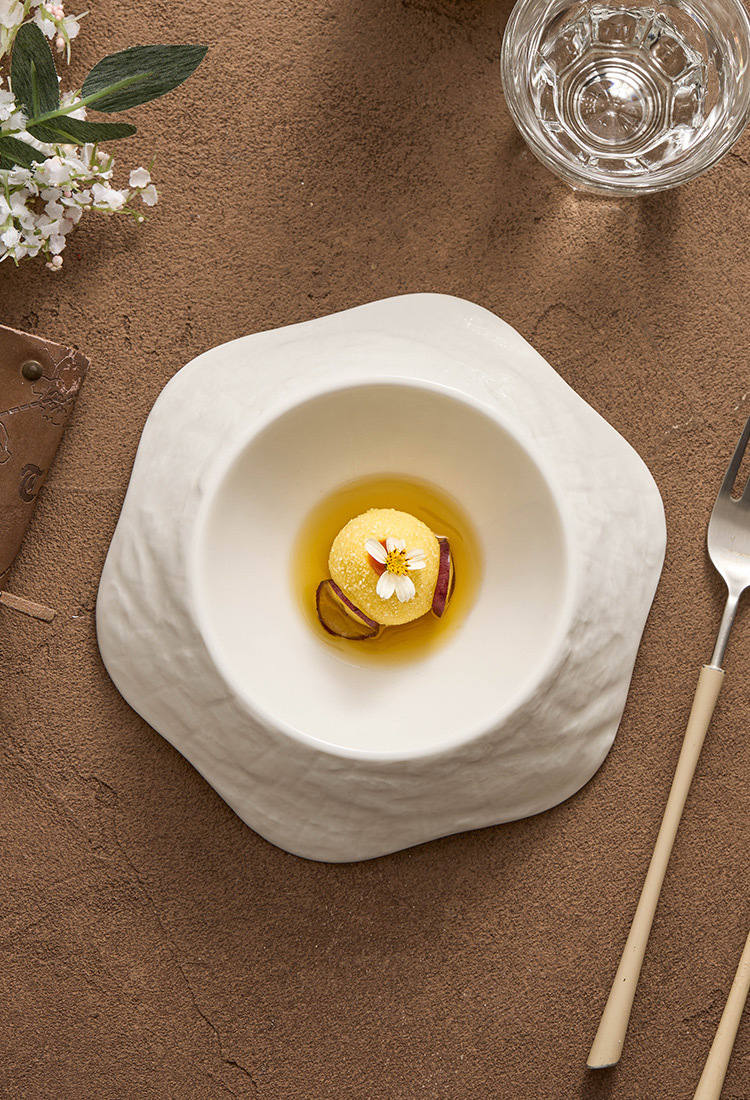 Textured white porcelain dish with handcrafted irregular form